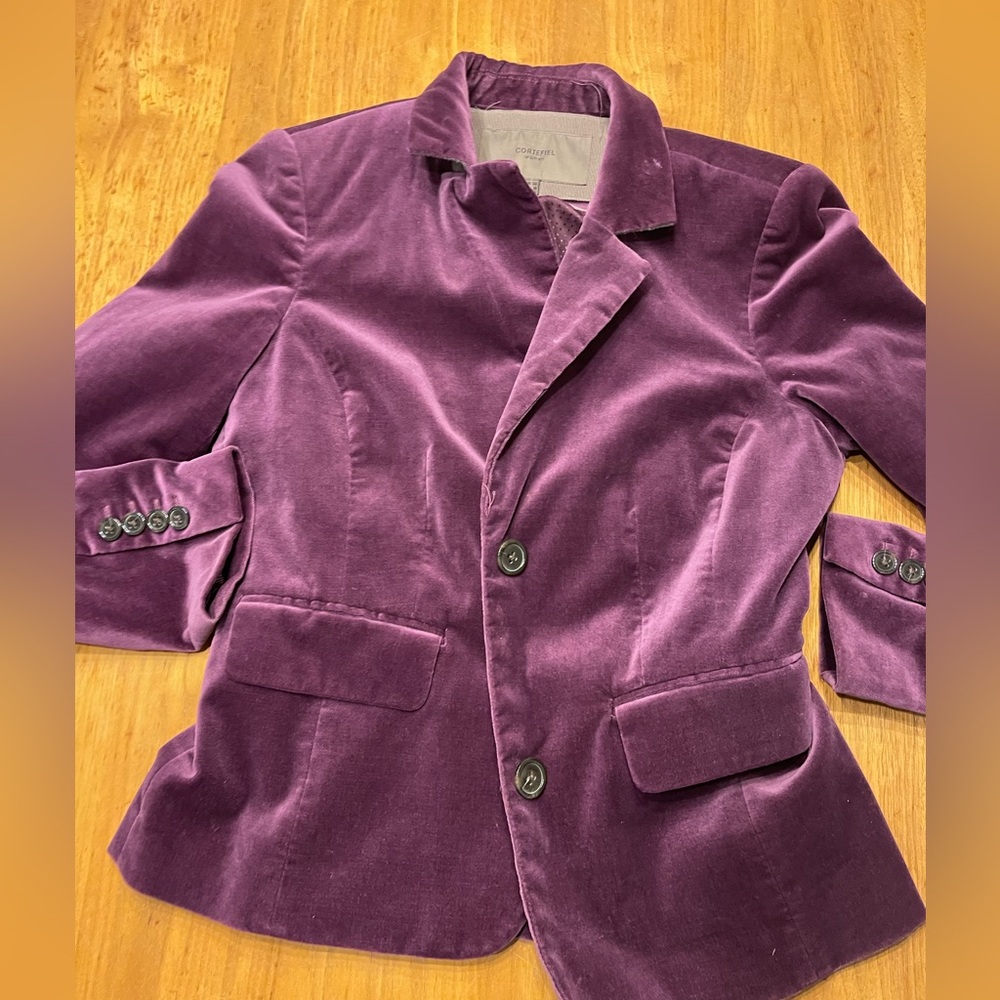 Dark plum purple blazer with striped lining detailing inner cuffs.